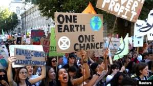 Crowd of people marching for climate action